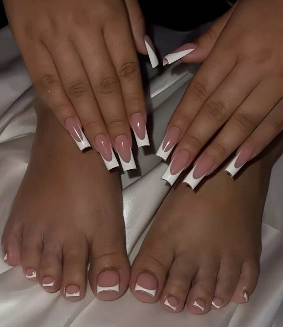 Long square French tip nails with a matching French pedicure